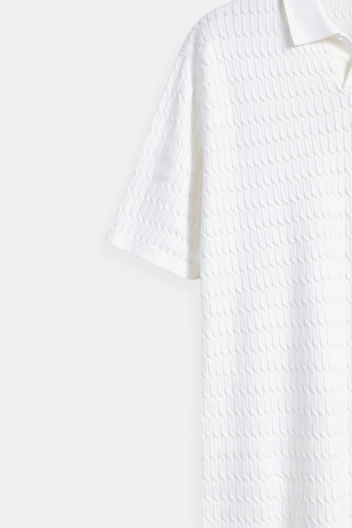 Polo in maglia bianco con motivo testurizzato