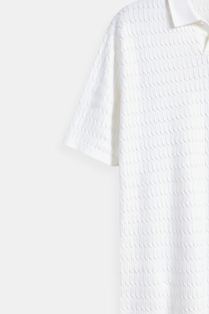 Polo in maglia bianco con motivo testurizzato