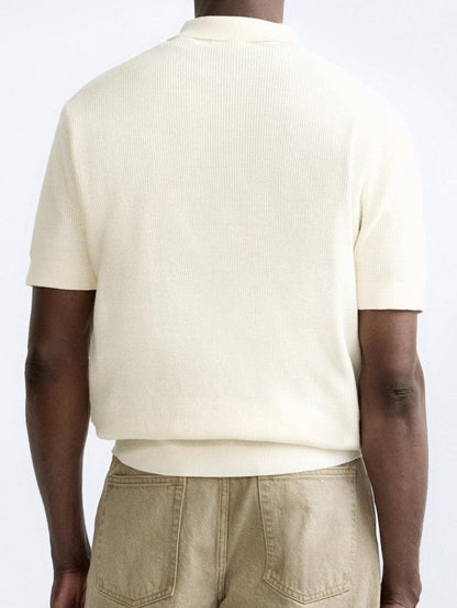 Elegante polo in maglia con zip