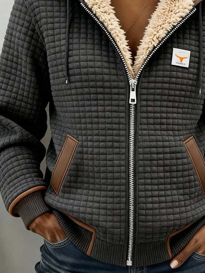 Sandra | Giacca trapuntata con zip e cappuccio, foderata in sherpa